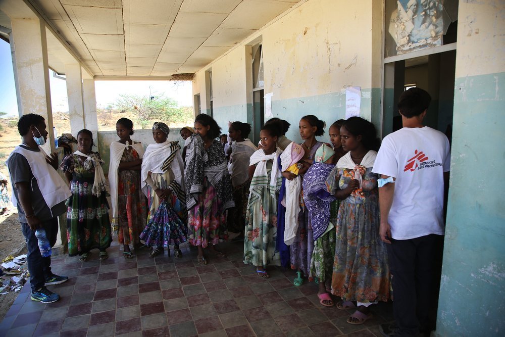 Women wait with their children to be seen by a doctor during an MSF mobile clinic in the village of Adiftaw, in the northern Ethiopian region of Tigray.