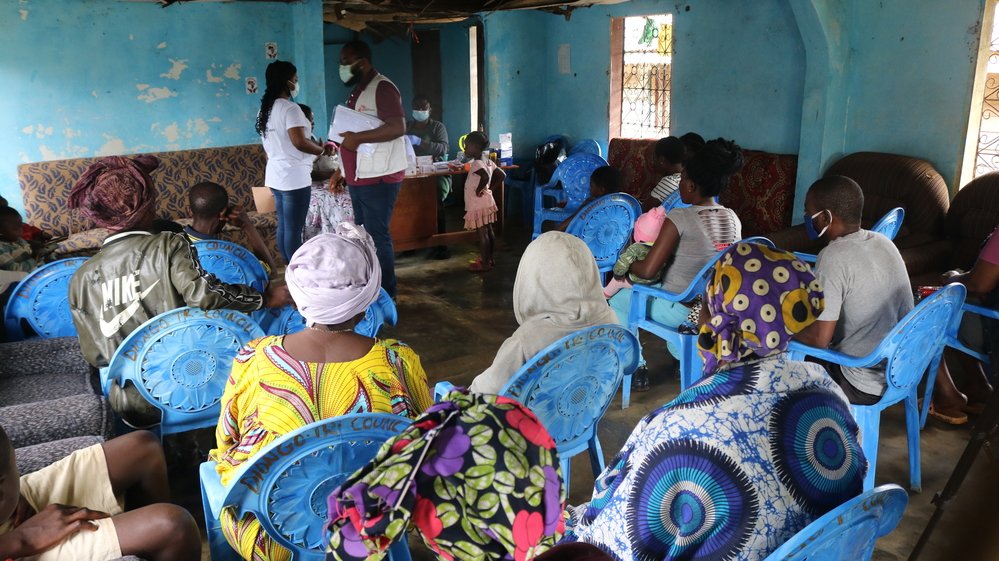 Members of the community have gathered at the council hall in Diongo commune, South-West Cameroon, for a consultation with community health nurse Violet Mesape.