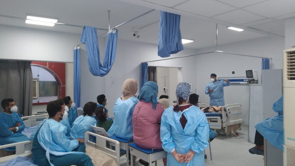 Healthcare workers at the Al-shifa COVID-19 Centre at the Baghdad Medical City during a MSF-run bedside training on the treatment of severely and critically ill COVID-19 patients. (January, 2022).