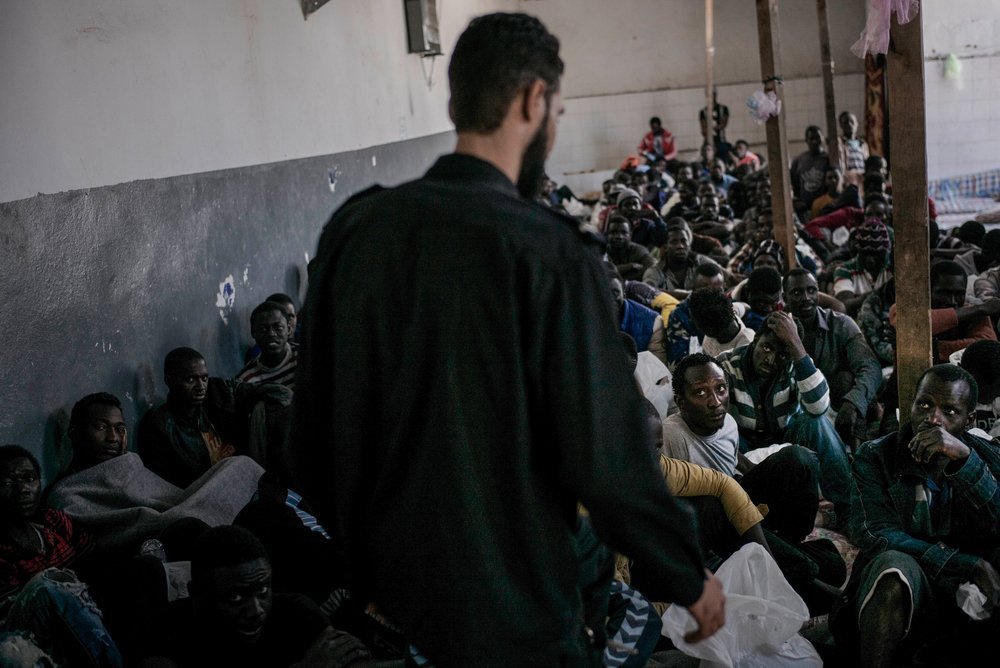 Men detaineed in Abu Salim detention centre. Detainees spend days and months in Libyan detention centres, without knowing when they will be released. 2017.