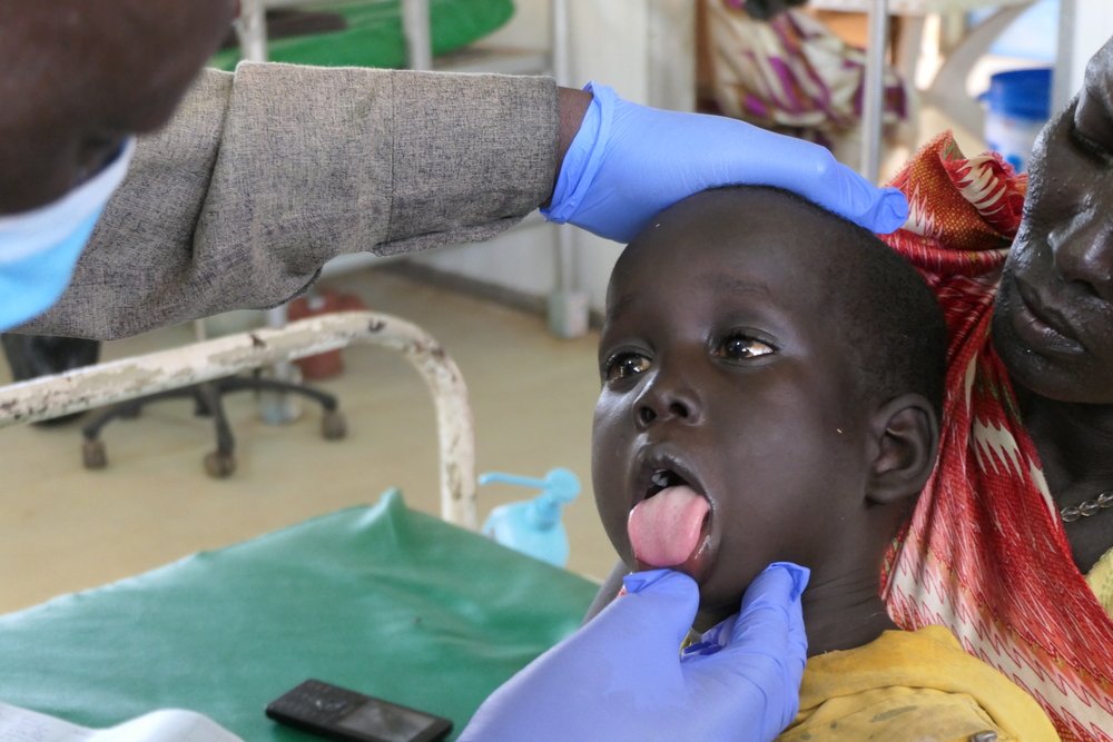 Kang Gatlok, 4 years old, during a medical consultation in which he tested positive for hepatitis E. The disease is most commonly spread through ingestion of water or food contaminated by an infected person’s faeces.