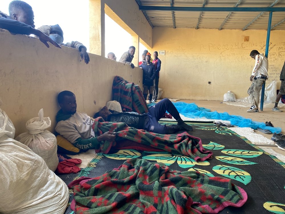 Young men recently deported from Algeria pass the time in a dormitory at the reception site in Assamaka, where MSF runs a health center. Deported migrants are abandoned on the Algerian side of the border, usually at night and have to walk 15km to Assamaka