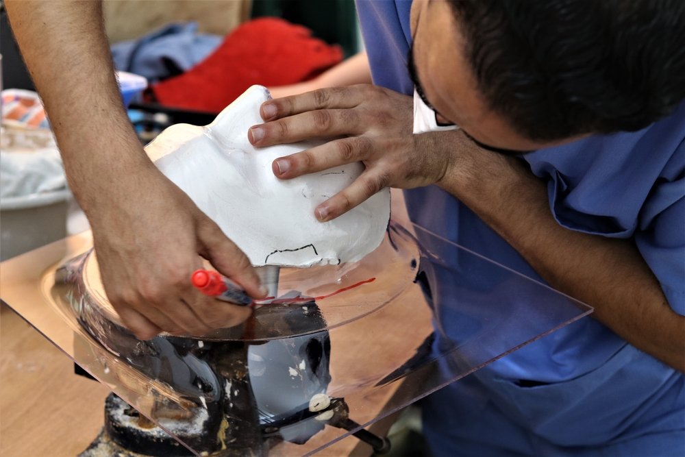 MSF physiotherapist, Mohammed Ali Abed El Qakder Al Qatrawi, makes a compressive face masks for a burn victim in an MSF’s burn and trauma clinic in Gaza city. 