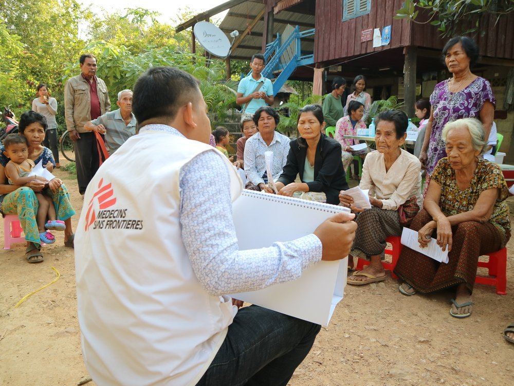 Khen Sophea carries out information and education activities during an active Hepatitis C case finding campaign in a village in Moung Ruessei district in Cambodia. 2019. 