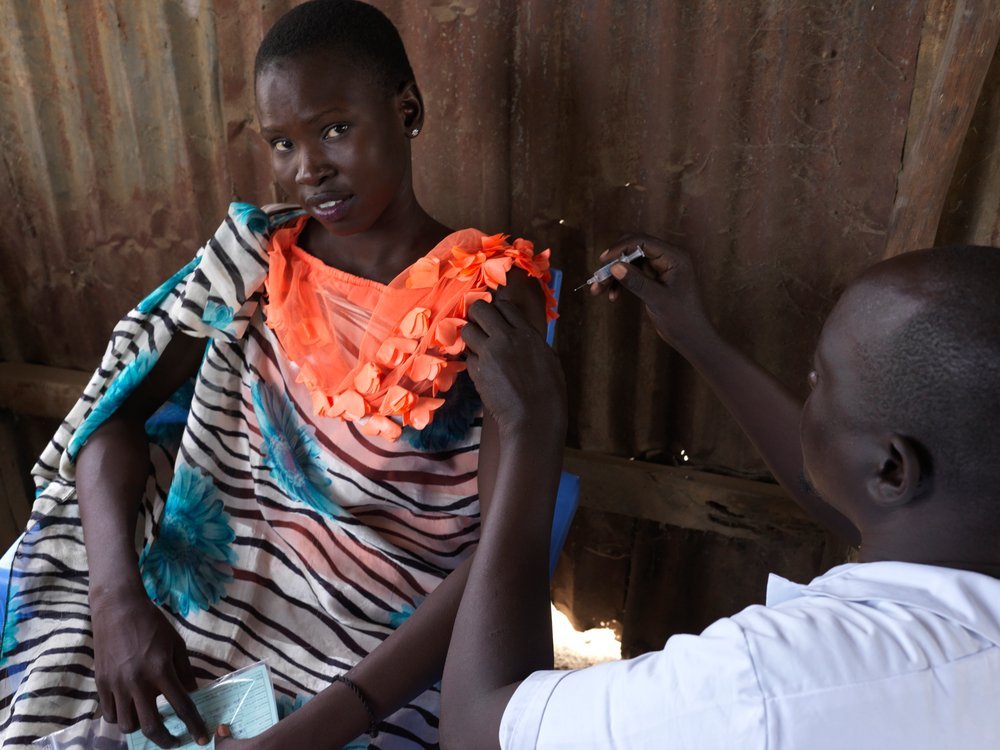 Nakia John is 16 years old and lives in Bentiu internally displaced persons camp. Nakia is being vaccinated against hepatitis E. (April, 2022).