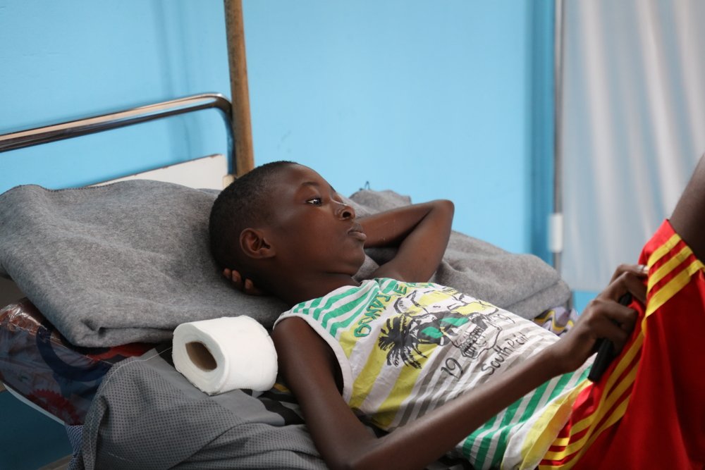 Tharcisse Likanzi, 11, has already undergone four surgeries following complications from typhoid fever. 