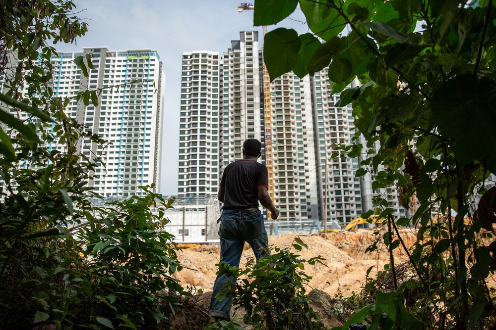 Muhammad, 25, a Rohingya refugee, is a construction worker on a condominium project in the Bayan Lepas district of Penang. He shares very basic accommodation on the site with other workers. Malaysia, April 2019.