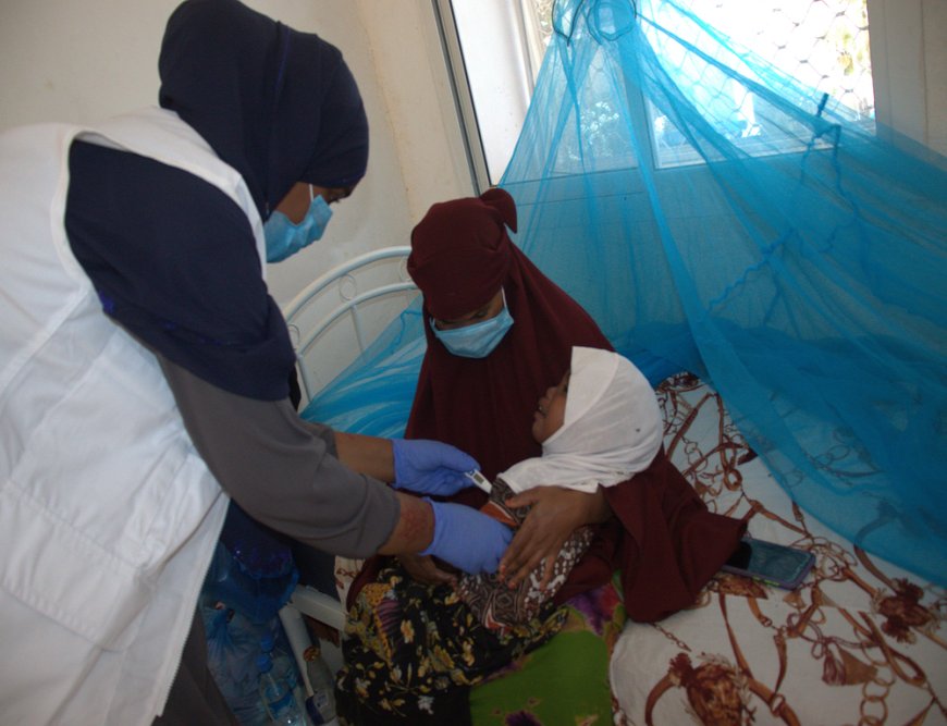 A Nurse attending to a child with measles in Las Anod General Hospital (LAGH) in Las Anod. (March, 2022).