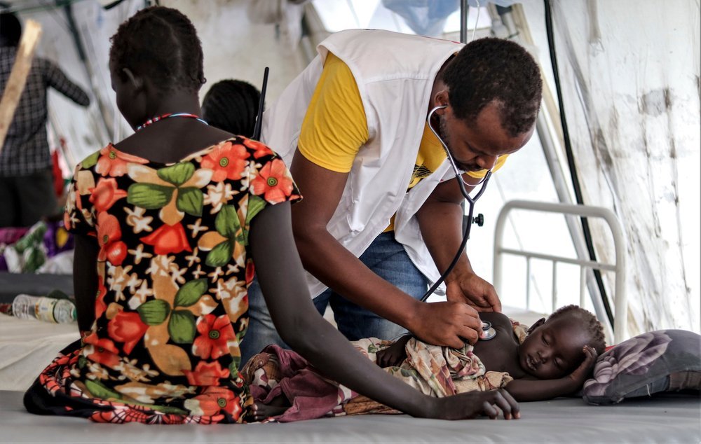 South Sudan. The Greater Pibor Administrative Area. Pibor Town. September 7, 2020. An MSF staff examines a patient in MSF’s inpatient unit in Pibor town.