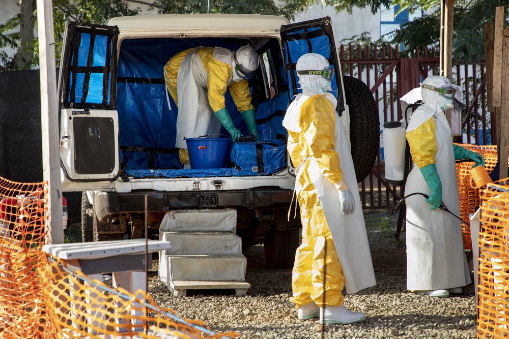 Hygienist cleans the ambulance that carried a suspect case of Ebola to the Transit Center