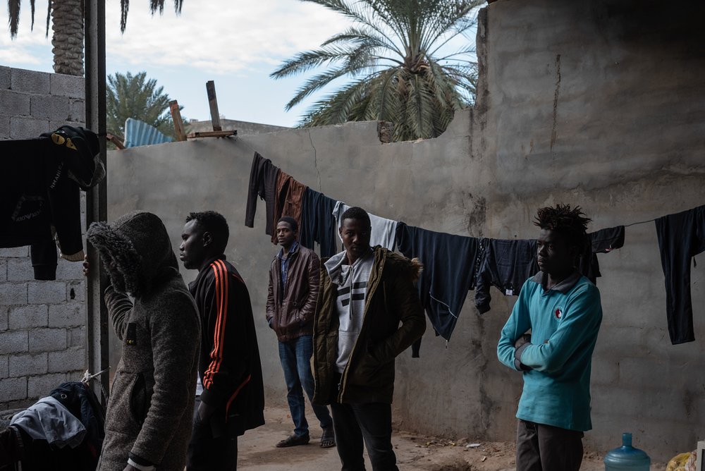 Refugees mostly from Darfur, Sudan are gathered in the courtyard of the place where they live in Gorgi district, south of Tripoli. Refugees are often living in dire conditions, in dilapidated buildings or small unfinished houses. 