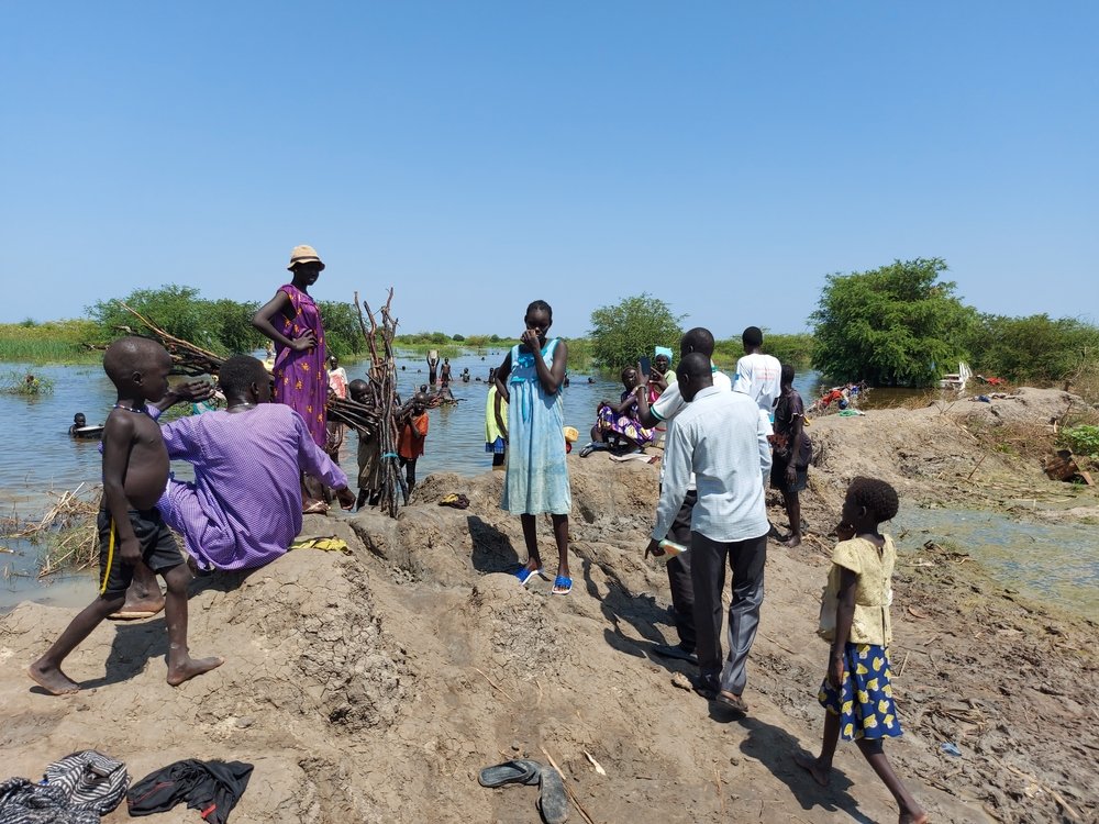 People swim, bathe and collect water in river in Bentiu, Unity state. 