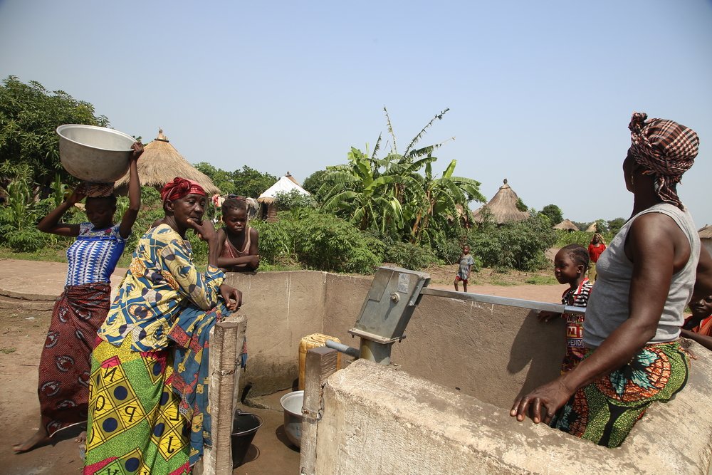 Women and children at a water point in site B for displaced people in the town of Kabo, in northern Central African Republic.