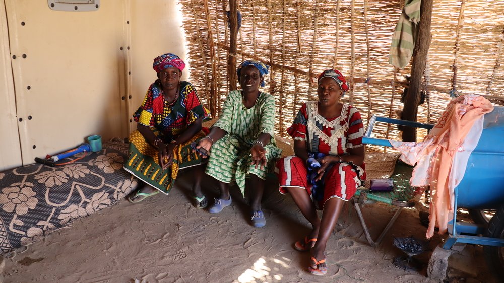 Three women who were forced from their homes and now live in the settlement for internally displaced people in Dori, in the Sahel region of Burkina Faso.