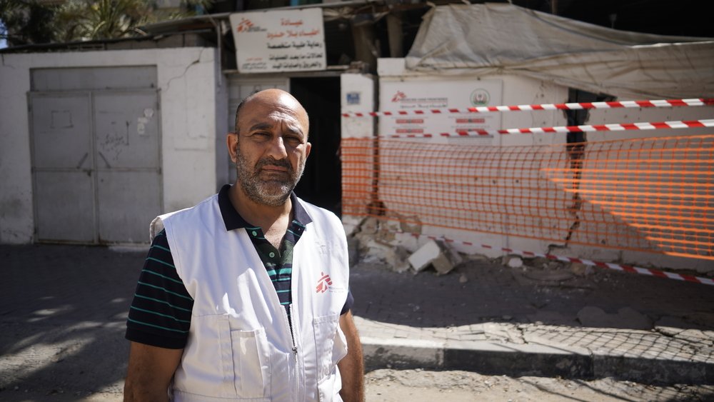 Aymen Al-Djaroucha, the project coordinator for MSF, stands in front of MSF’s clinic in Gaza after it was damaged by Israeli aerial bombardment, leaving a sterilization room unusable and a waiting area damaged.