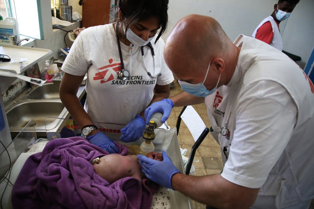 MSF medics try to resuscitate a newborn baby at the health centre in Abi Adi, a town in central Tigray, Ethiopia