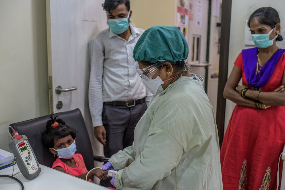 MSF Nurse taking vitals of six years old MDR-TB girl child during her monthly follow-up at MSF independent Clinic, Mumbai- India. 