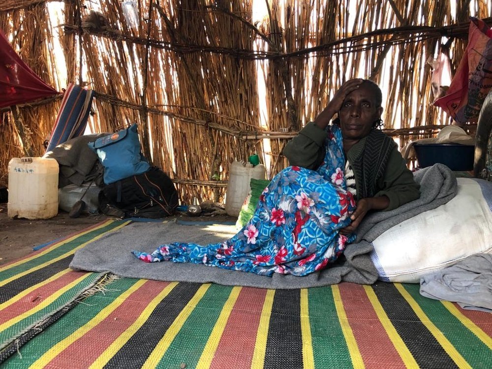 Hadahra, 60 year old woman, &quot;I am an old, sick woman so I eat little. But for the rest of my family, they go to the forest or to the river banks to collect wood to sell and then pay for ingredients.” Hamdayet, Sudan. 