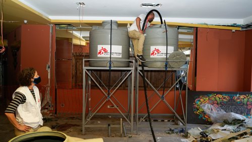 MSF staff installing water containers, in Gemmayzeh neighborhood of Beirut. 
