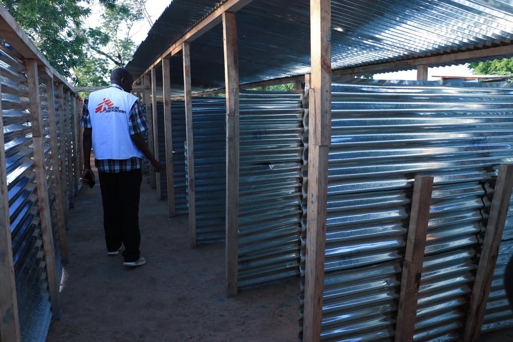 MSF logistician inspects the work that was done at the pit latrines constructed by MSF at Bangula camp where people displaced by Tropical Cyclone Ana are residing.(February, 2022).