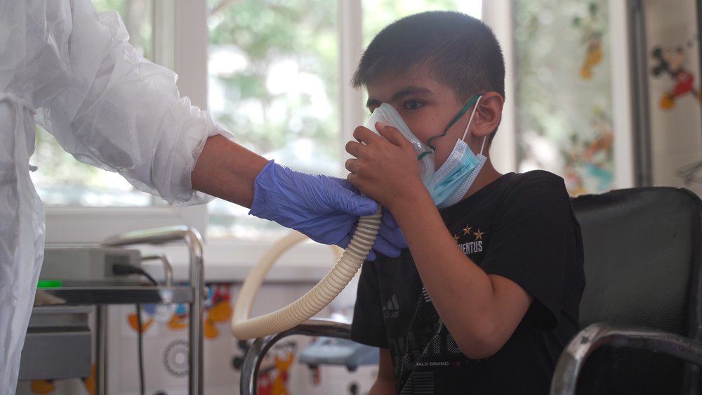 Muhammad Yusuf (8) is undergoing a sputum induction in a specialized room in Paediatric TB hospital in Dushanbe. (July, 2021).