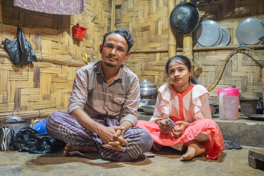 Rohingya refugee Nur Huda and his daughter Hosna, have been living in a small, bamboo shelter in Jamtoli camp in Cox’s Bazar district, Bangladesh, for the past five years. (June, 2022).