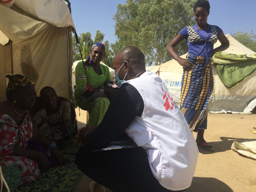 Daniel Dao, MSF mental health activities manager, visiting a family that has been displaced by conflict and is now living in Sokolo, Niono, in the centre of Mali.