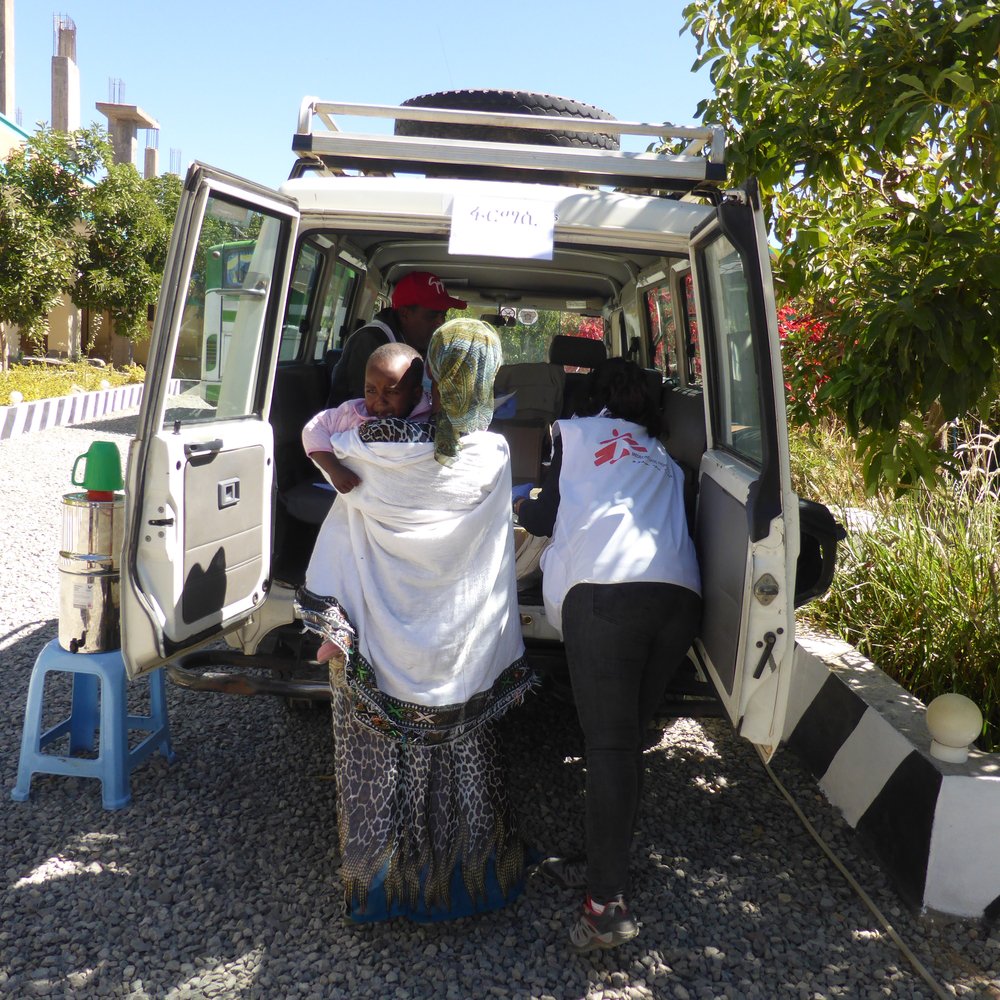 MSF staff transport a patient during a mobile clinic in Hawzen, northeast Tigray.