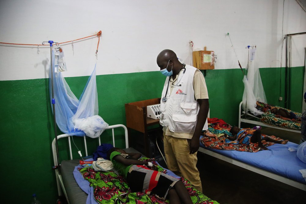 An MSF staff member checks on the condition of a child in the MSF hospital paediatric ward in the town of Kabo, in northern Central African Republic.