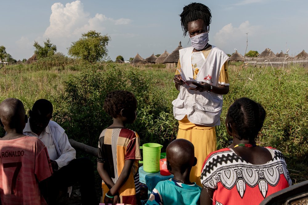 An MSF staff member gives SMC medication to children in a village in Aweil, South Sudan, October 28th, 2021
