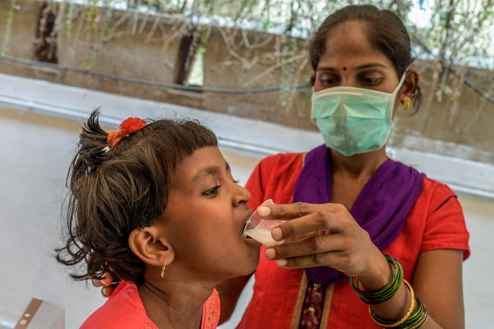 Mother of six-year-old MDR TB girl child giving manipulated form of Bedaquiline tablet.
