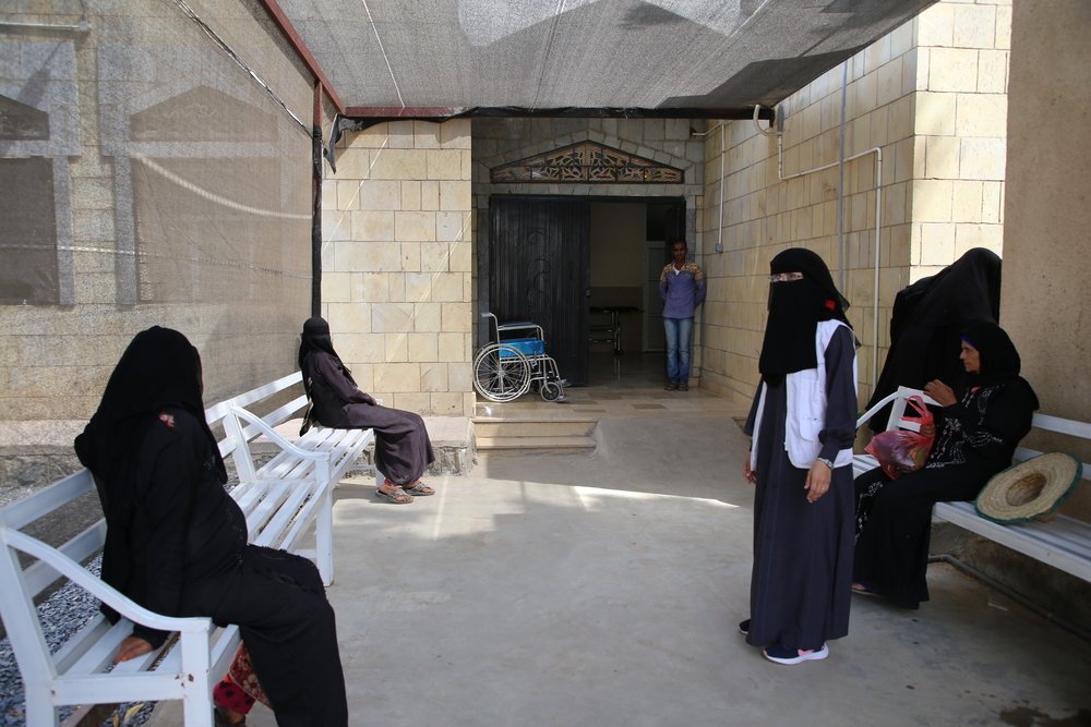 Women wait outside the Al Qanawis Mother &amp; Child Hospital in the Hodeidah governorate of northwestern Yemen.