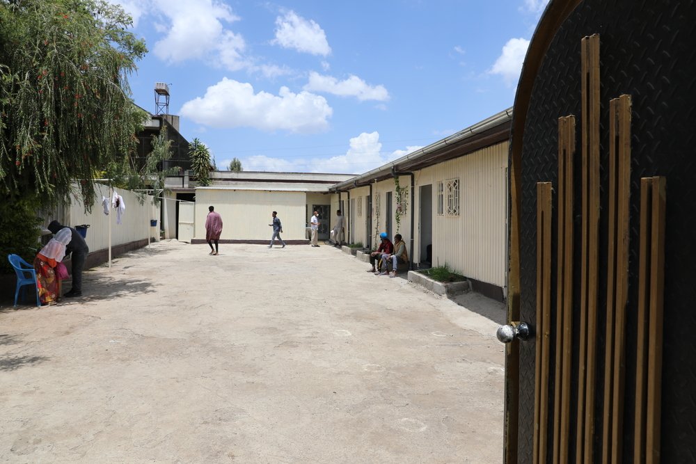 Courtyard of the Therapeutic Counselling Centre in Addis Ababa, Ethiopia. Returnees spend from a few days up to a month or more at the center, where they receive food, clothes, shelter, and assistance for transportation.
