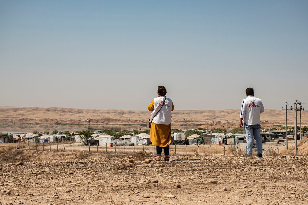 MSF staff near Alwand 2 camp in the Khanaqin district of Diyala governorate. Many people displaced from different regions have been living in the camp for years. Iraq, August 2019.