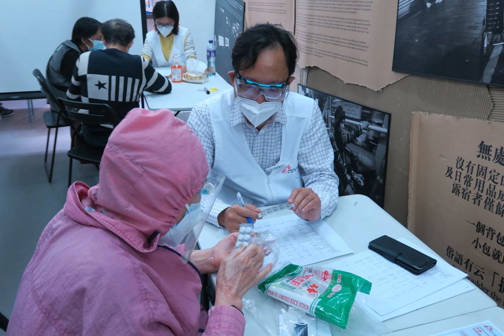 Ms Chan, 75, is a senior citizen who lives alone in Sham Shui Po. She came to consult Dr Wilson Li, MSF Surgeon, in full protective gear, including two masks, goggles, and a face shield. (March, 2022).