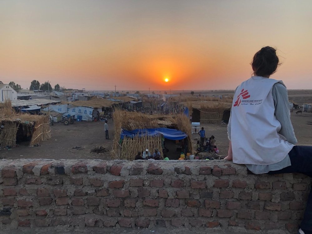 An MSF staff overlooking the reception area in Hamadyet where more than 10,000 are living as they await transfer to a permanent  camp location.