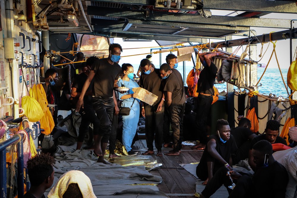 Humanitarian Affairs Officer Ilina Angelova speaking to people on deck of the Sea-Watch 4 in August 2020.