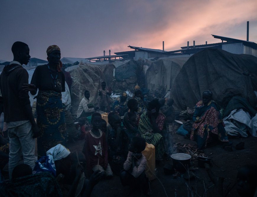 Families near their tents in Rhoe Internally displaced people camp at sunset. (December, 2021).