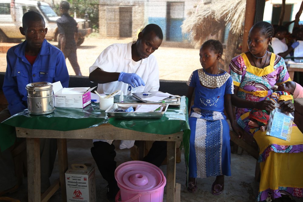 A Ministry of Health staff member checks a child’s rapid malaria test at an MSF-supported health centre in Farazala, northern Central African Republic.
