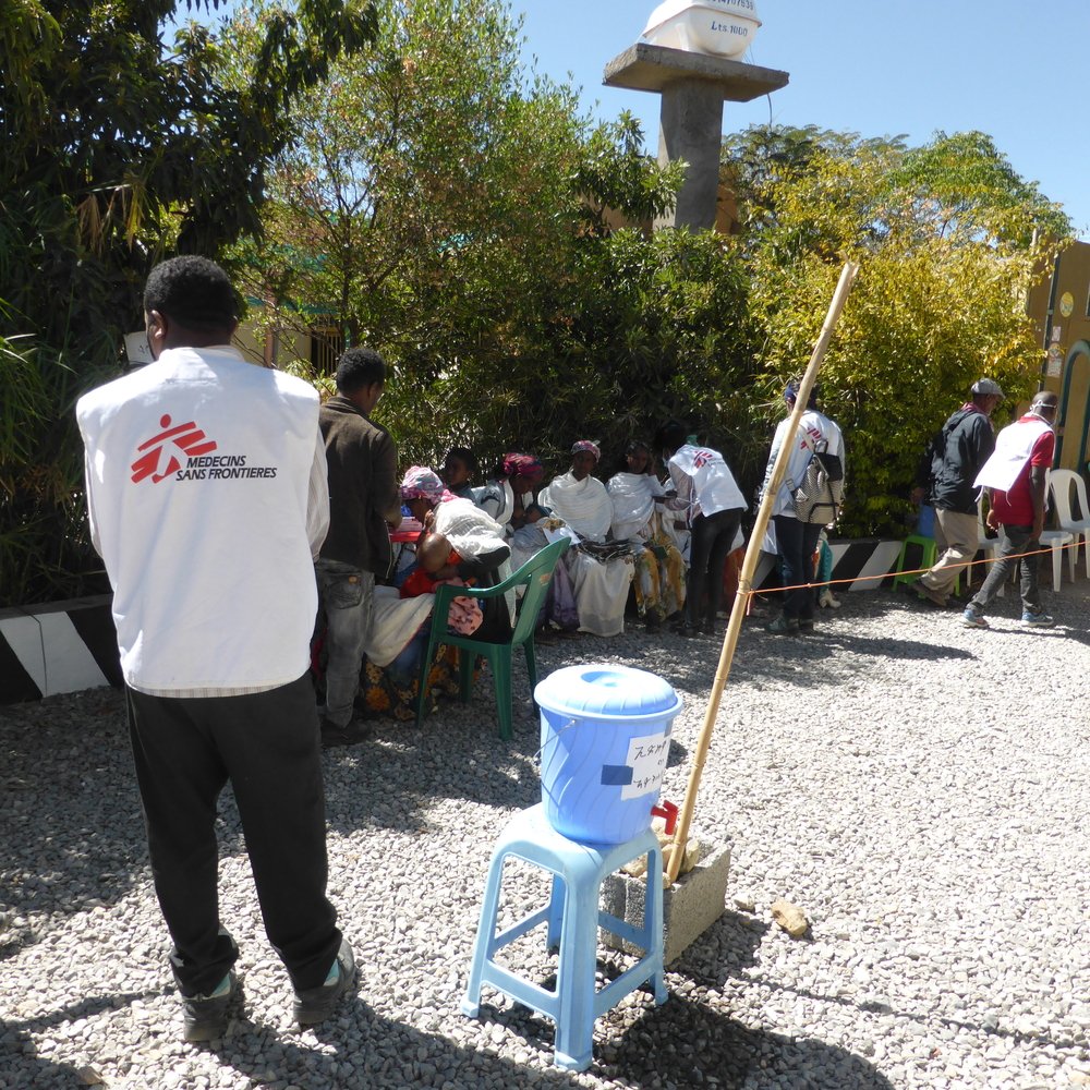 An MSF staff member does crowd control during a mobile clinic in Hawzen, northeast Tigray.