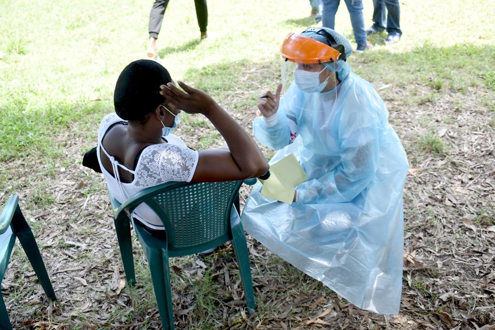 A migrant from Haiti receives mental health attention in Trojes, Honduras.