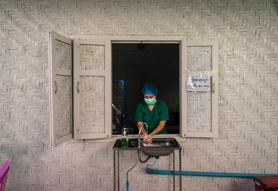 An MSF staff member washes her hands at MSF’s HIV clinic in Myitkyina on 1 October 2021.