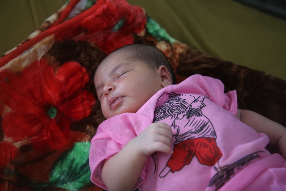 Fatima, 17, who arrived at the Al Qanawis Mother &amp; Child Hospital with a fever in her last month of pregnancy. Her baby girl was admitted to the neonatology ward with an infection.