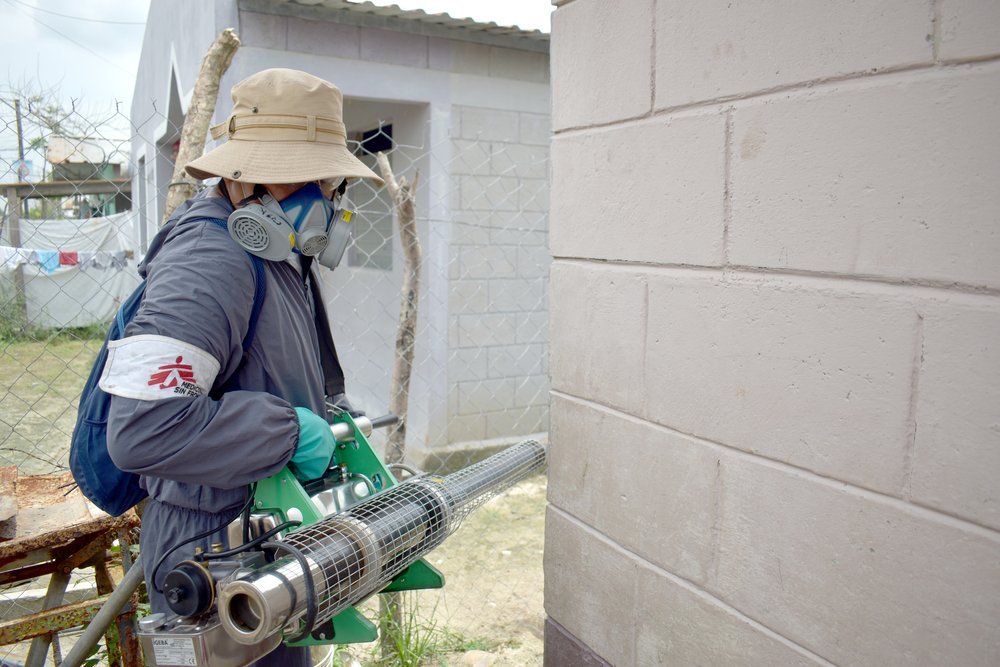 An MSF team member fumigates the interior and exterior of houses in an area of Cortés department  affected by flooding in the wake of hurricanes Eta and Iota.