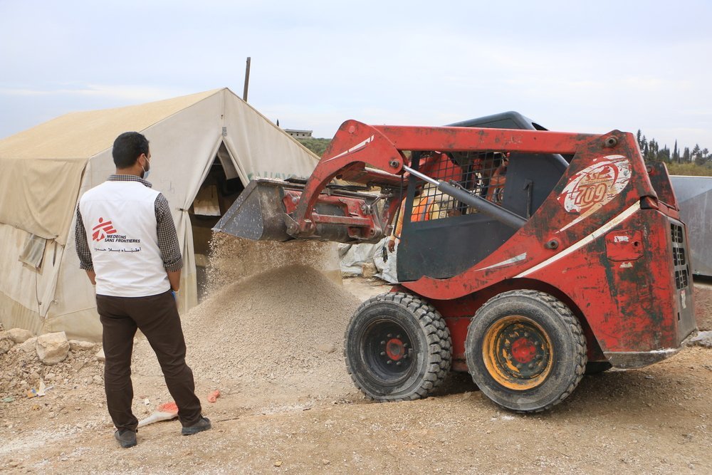 MSF logistics staff are preparing to raise the floors of tents in a displaced camp in northwest Syria. // November 2021, Northwest Syria © Abd Almajed Alkarh