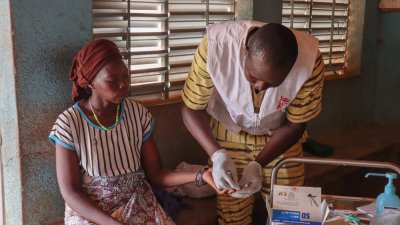 The nurse checks patients&#039; vitals: weight, height, temperature, blood pressure and malaria RDT before referring them to the consultation room.