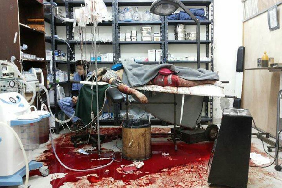 2013: A critically wounded man lies on an operating table in a makeshift hospital in a besieged district of east Damascus.