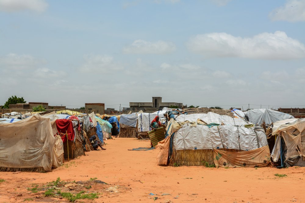 The gathering site at Sudan Open University, where thousands of displaced people have sought shelter. MSF built latrines and installed tap stands, but raw sewage, stagnating water and open defecation is still a problem. 